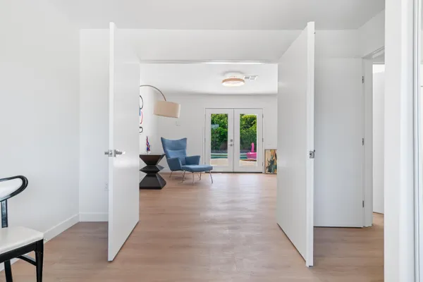 an aerial view of a house with a swimming pool and outdoor space