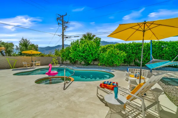a view of a swimming pool with a patio