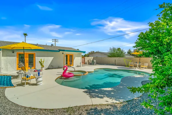 a view of a swimming pool with a yard