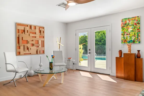 a kitchen with a sink a stove a refrigerator and cabinets