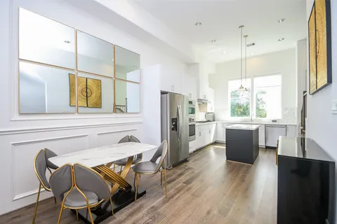 a kitchen with a sink stove and refrigerator