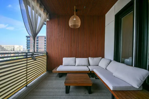 a view of a couches in the balcony