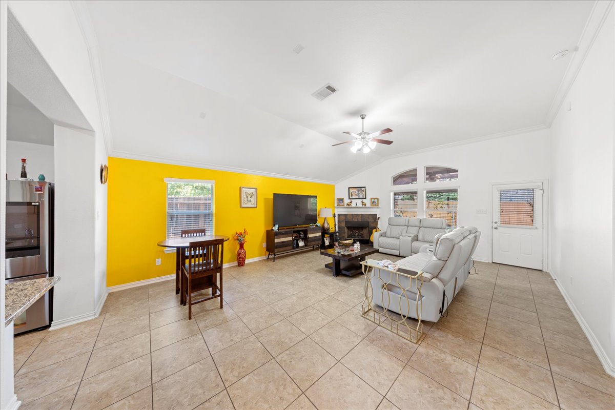 349 Razzmatazz Trail Buda, TX 78610 - Photo 18 of 40 a view of a livingroom with furniture and a flat screen tv