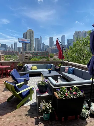 a view of a terrace with furniture and outdoor seating