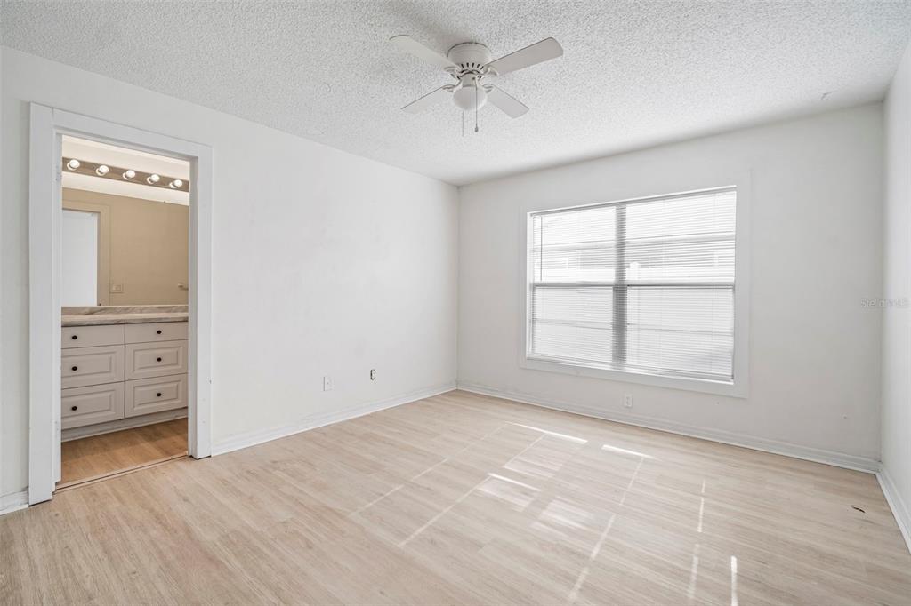12825 Tallowood Drive Riverview, FL 33579 - Photo 30 of 43 an empty room with windows and cabinet