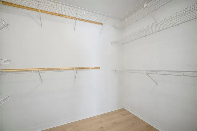 a bathroom with a granite countertop sink a toilet and bathtub