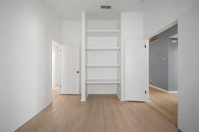 a view of an empty walk in closet