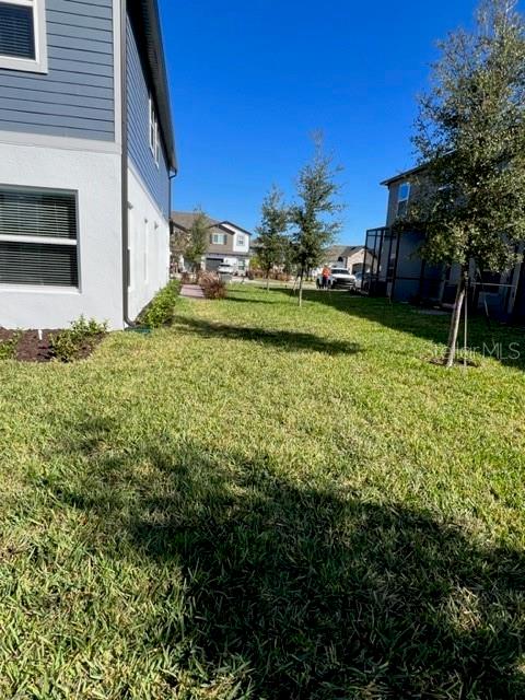 2327 Prickly Pear Way Sanford, FL 32771 - Photo 23 of 33 a backyard of a house with lots of green space