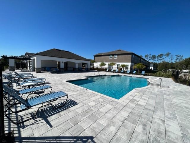 2327 Prickly Pear Way Sanford, FL 32771 - Photo 32 of 33 a view of a house with swimming pool