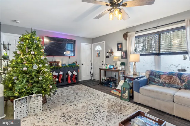 a living room with furniture and a flat screen tv