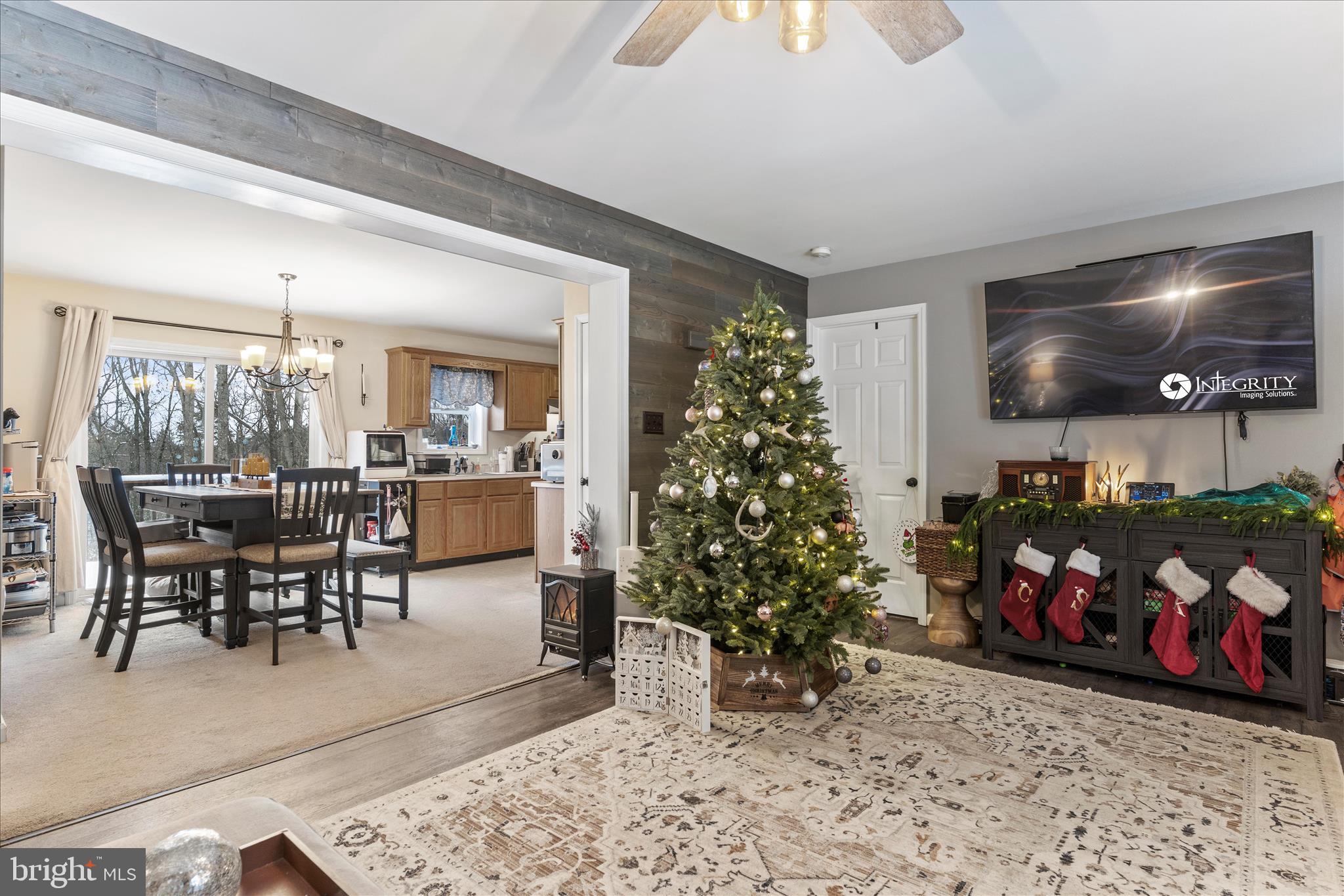 1565 Fox Hollow Road Shermans Dale, PA 17090 - Photo 13 of 41 a living room with a couch and a potted plant