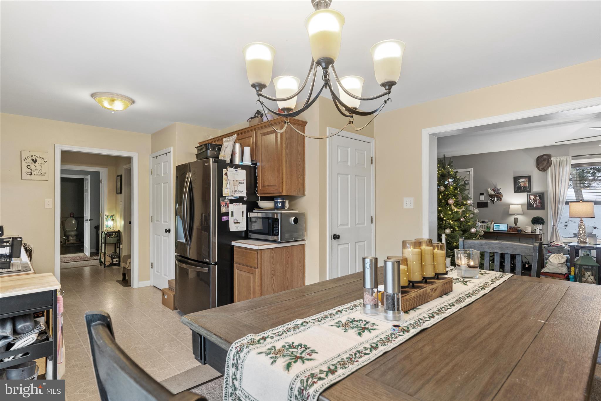 1565 Fox Hollow Road Shermans Dale, PA 17090 - Photo 15 of 41 a view of a dining room and kitchen with wooden floor