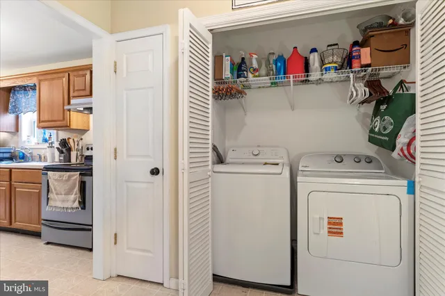 a utility room with dryer and washer