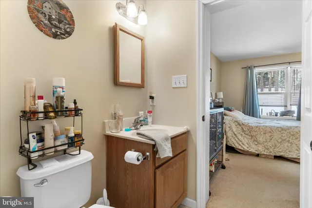 a bedroom with bed and a desk