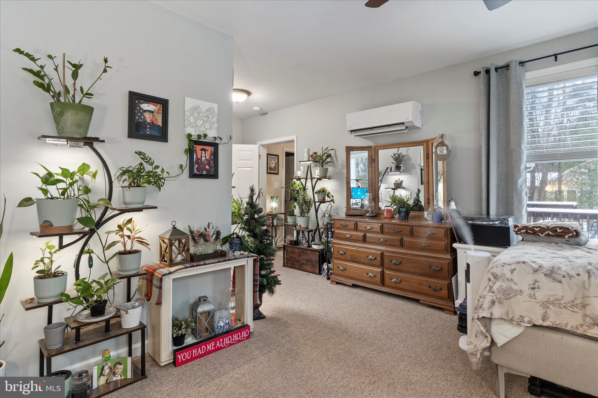 1565 Fox Hollow Road Shermans Dale, PA 17090 - Photo 27 of 41 a living room with furniture and a potted plant