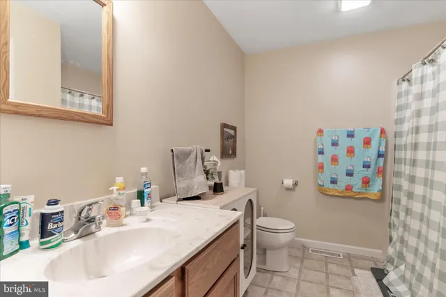 a bedroom with bed and a window