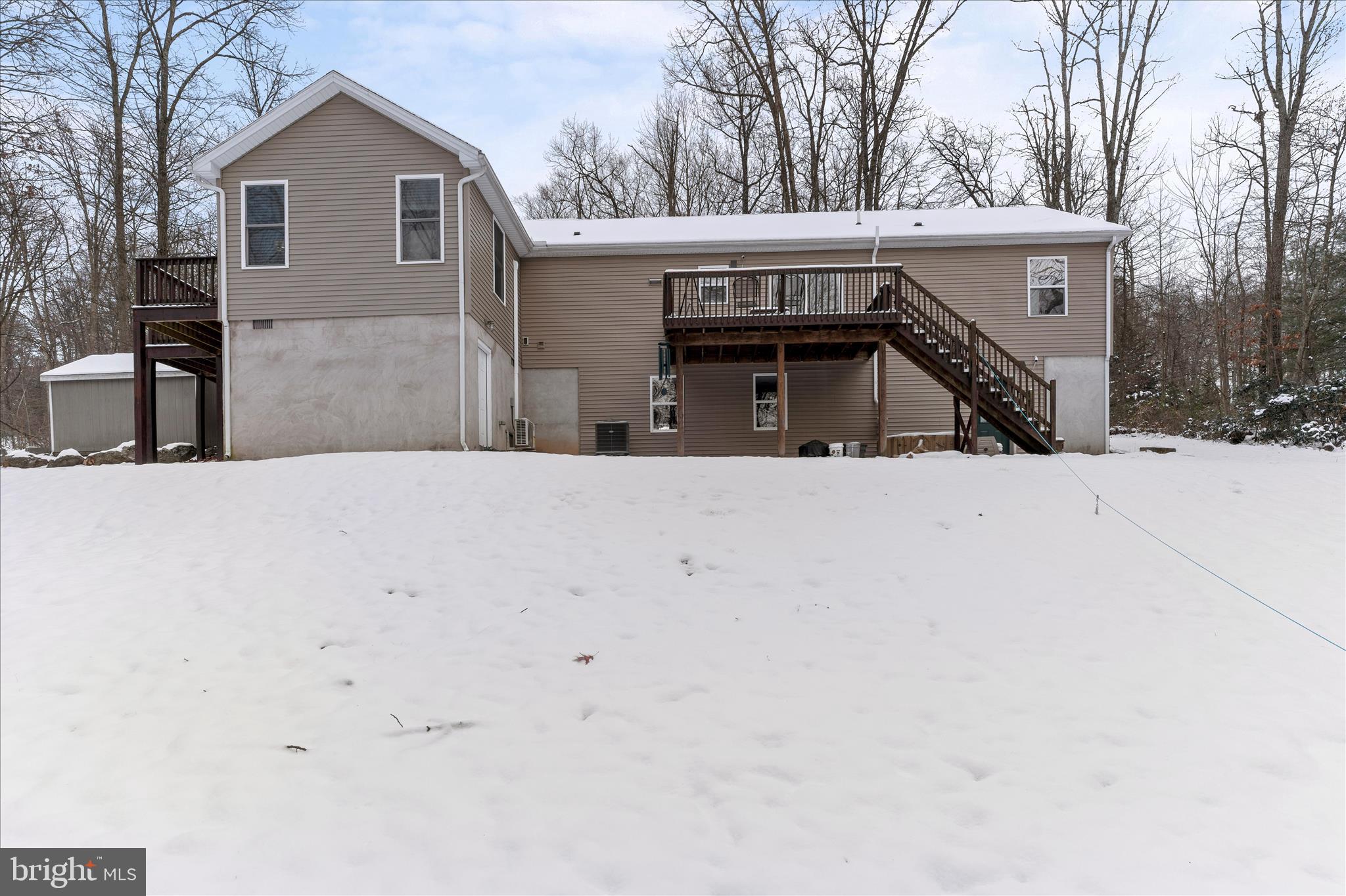 1565 Fox Hollow Road Shermans Dale, PA 17090 - Photo 8 of 41 a view of a house with a snow in the yard