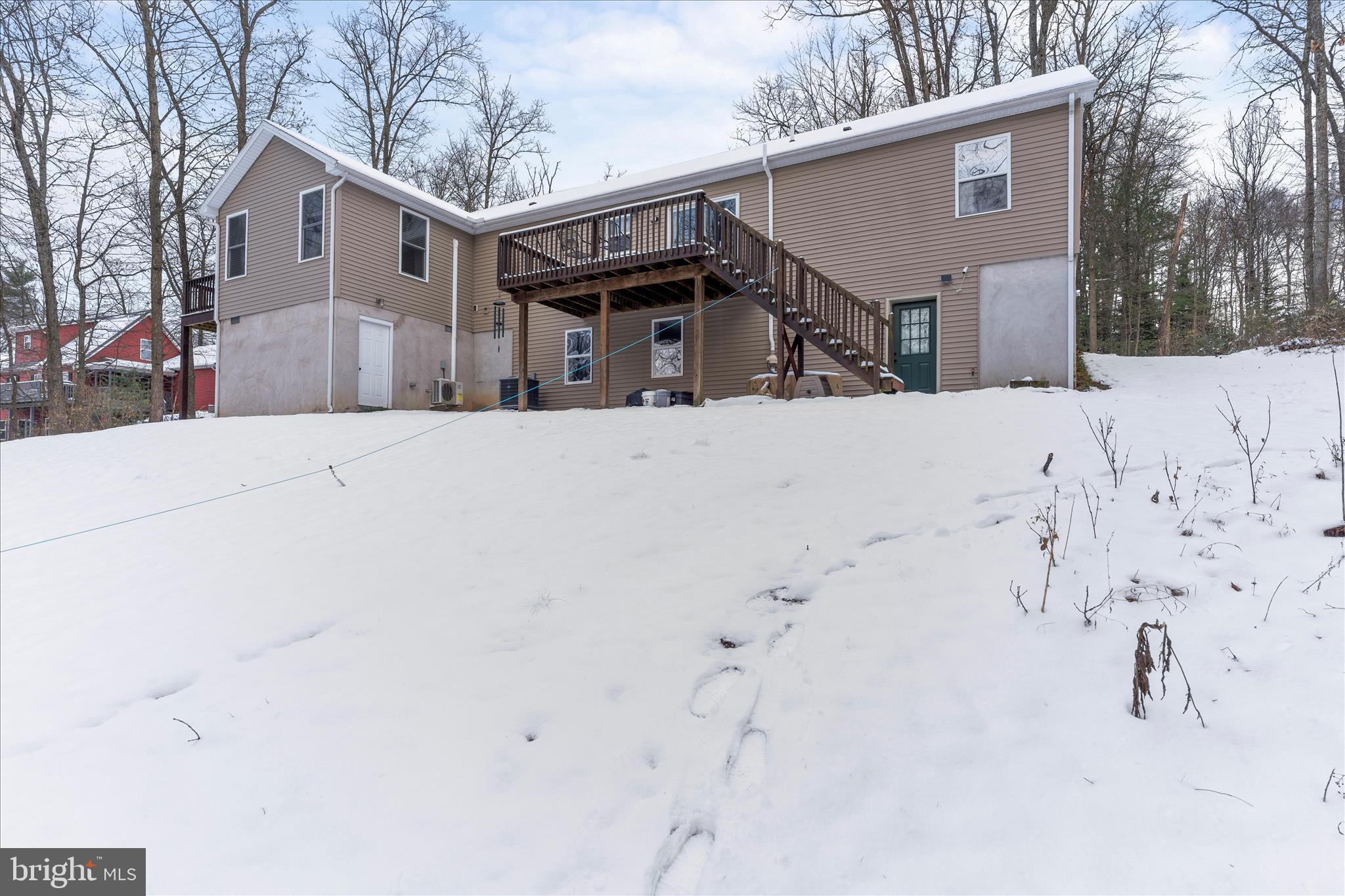 1565 Fox Hollow Road Shermans Dale, PA 17090 - Photo 9 of 41 a front view of a house with a yard covered in snow