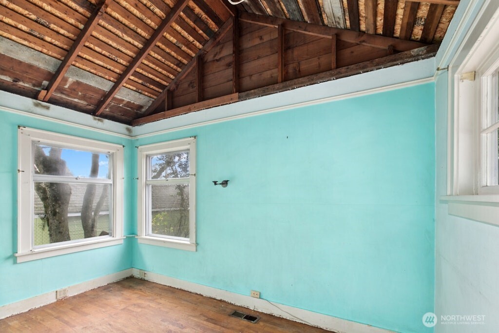 5627 44th Avenue Southwest Seattle, WA 98136 - Photo 14 of 37 a view of empty room with windows