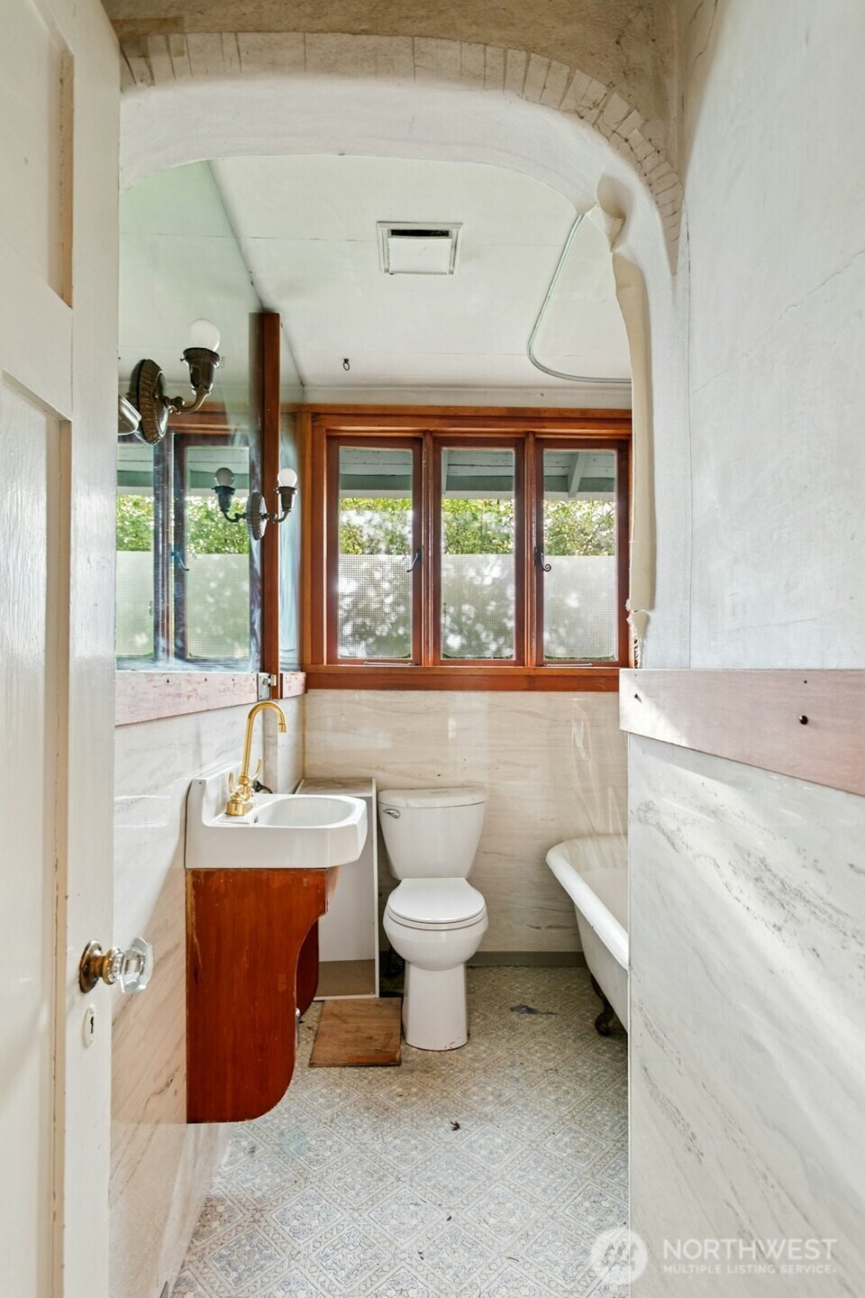 5627 44th Avenue Southwest Seattle, WA 98136 - Photo 18 of 37 a bathroom with a toilet sink and mirror