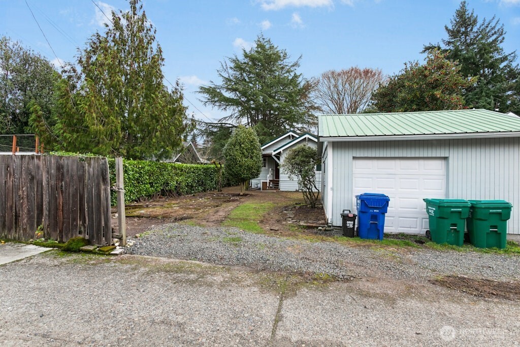 5627 44th Avenue Southwest Seattle, WA 98136 - Photo 29 of 37 a front view of house with swing
