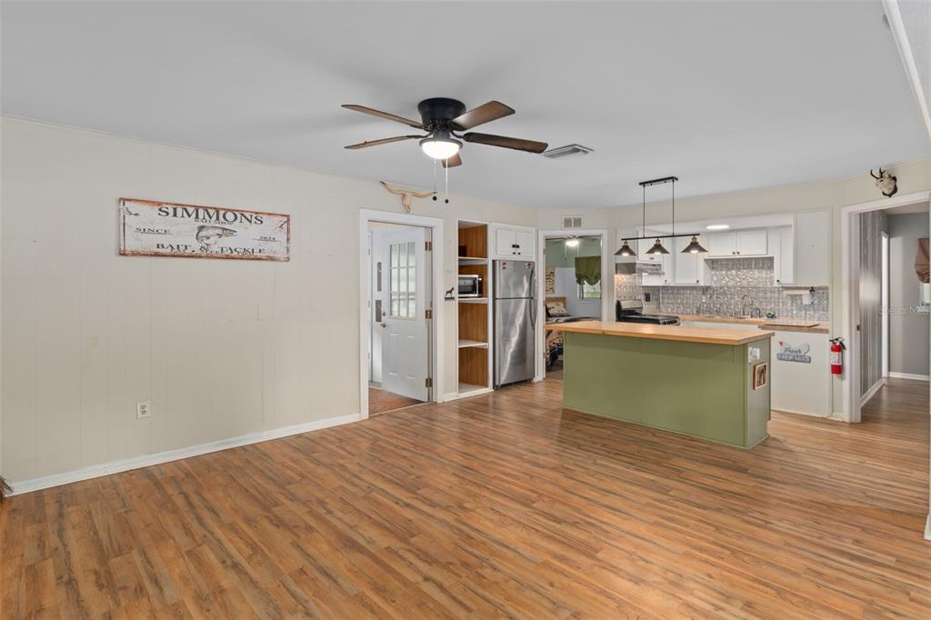 353 North Robin Hood Road Inverness, FL 34450 - Photo 13 of 59 a view of a kitchen with a sink a refrigerator and window