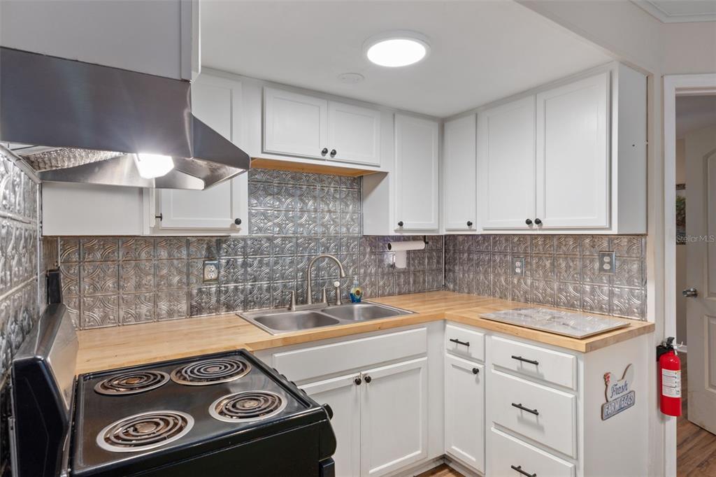 353 North Robin Hood Road Inverness, FL 34450 - Photo 17 of 59 a kitchen with a sink and cabinets