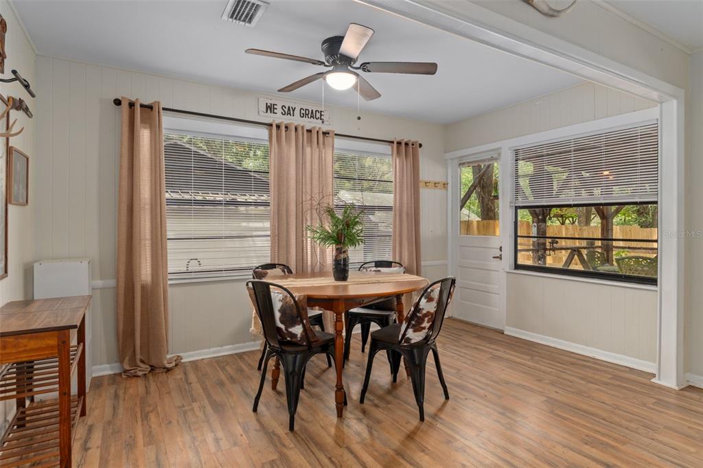 353 North Robin Hood Road Inverness, FL 34450 - Photo 20 of 59 a view of a dining room with furniture window and wooden floor