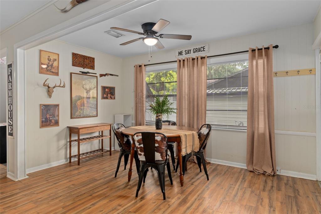 353 North Robin Hood Road Inverness, FL 34450 - Photo 21 of 59 a view of a dining room with furniture window and wooden floor