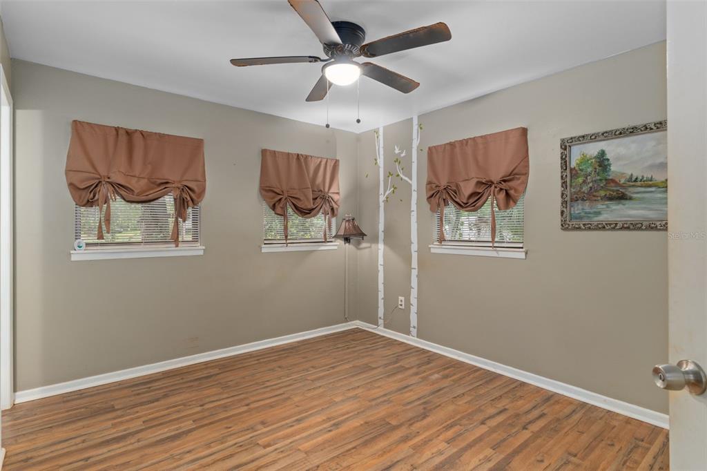 353 North Robin Hood Road Inverness, FL 34450 - Photo 23 of 59 a view of empty room with wooden floor
