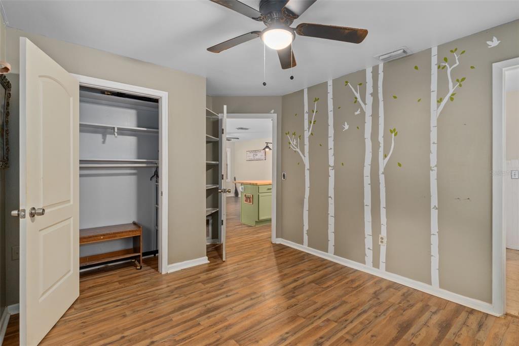 353 North Robin Hood Road Inverness, FL 34450 - Photo 24 of 59 a view of empty room with wooden floor and ceiling fan