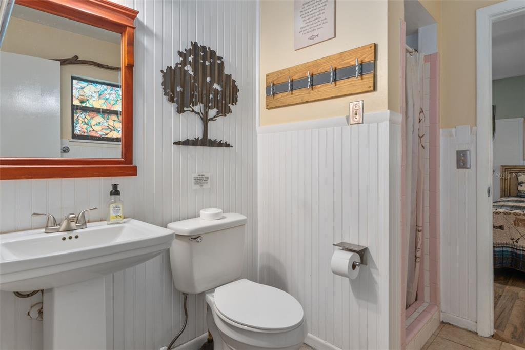 353 North Robin Hood Road Inverness, FL 34450 - Photo 25 of 59 a bathroom with a sink a toilet and shower