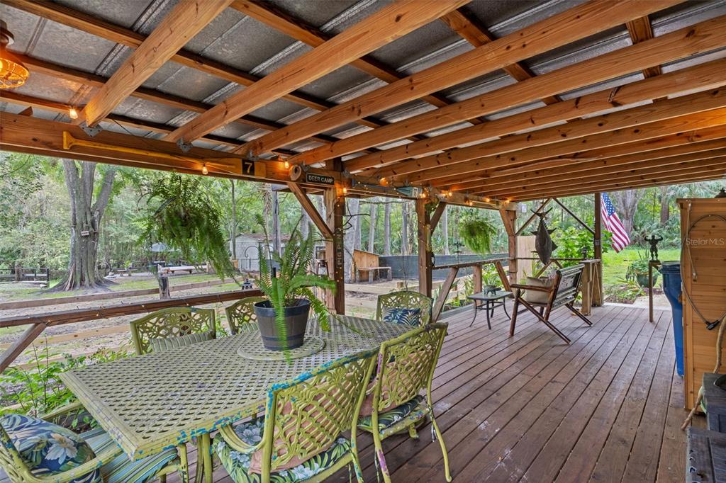 353 North Robin Hood Road Inverness, FL 34450 - Photo 32 of 59 a view of a patio with table and chairs and wooden floor