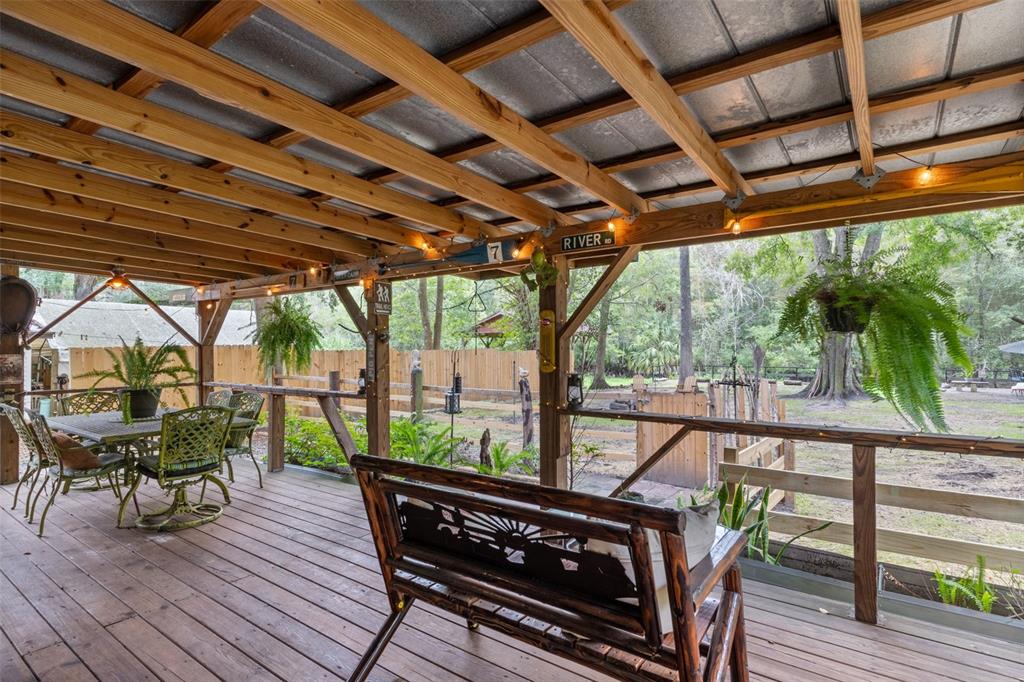 353 North Robin Hood Road Inverness, FL 34450 - Photo 33 of 59 a view of a chairs and table in the balcony