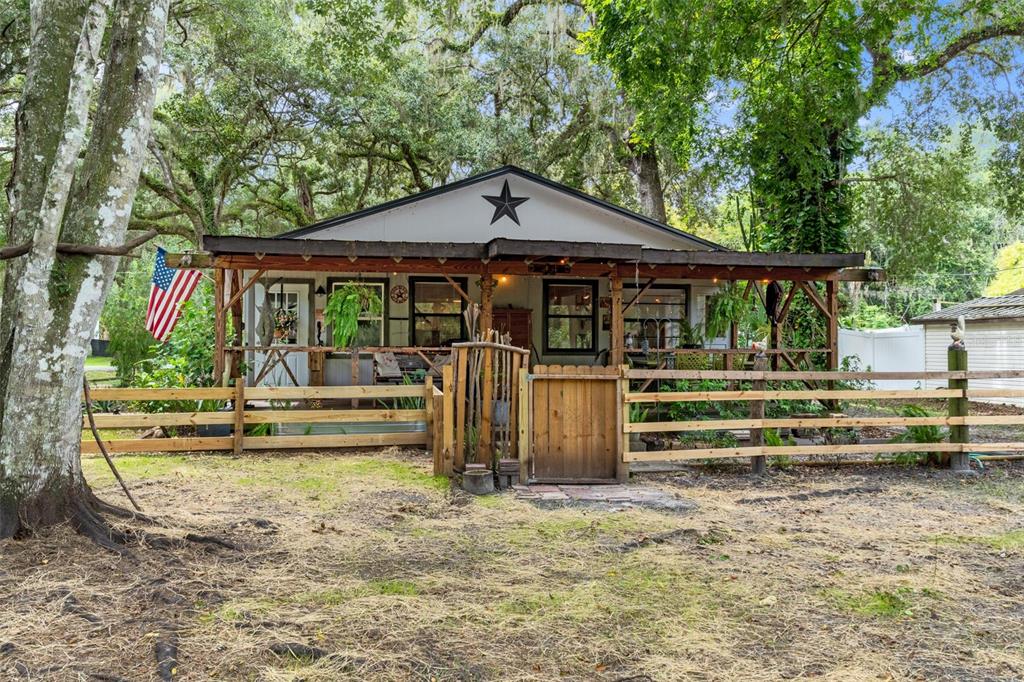 353 North Robin Hood Road Inverness, FL 34450 - Photo 39 of 59 a view of a house with a yard balcony and furniture