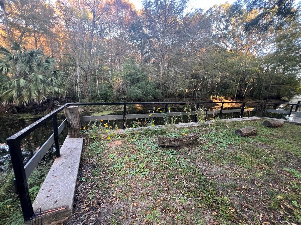 353 North Robin Hood Road Inverness, FL 34450 - Photo 52 of 59 a view of a backyard with sitting area