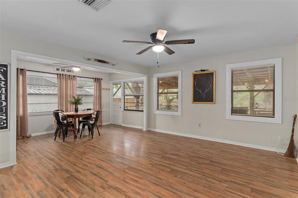 353 North Robin Hood Road Inverness, FL 34450 - Photo 10 of 59 a dining room with wooden floor and stainless steel appliances