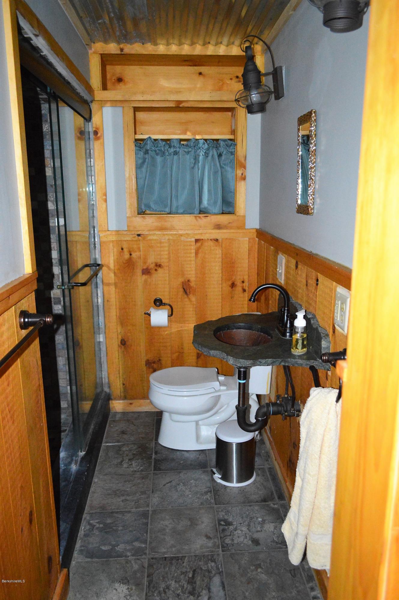 32 Chestnut Road Richmond, MA 01201 - Photo 12 of 31 a bathroom with a sink toilet and shower