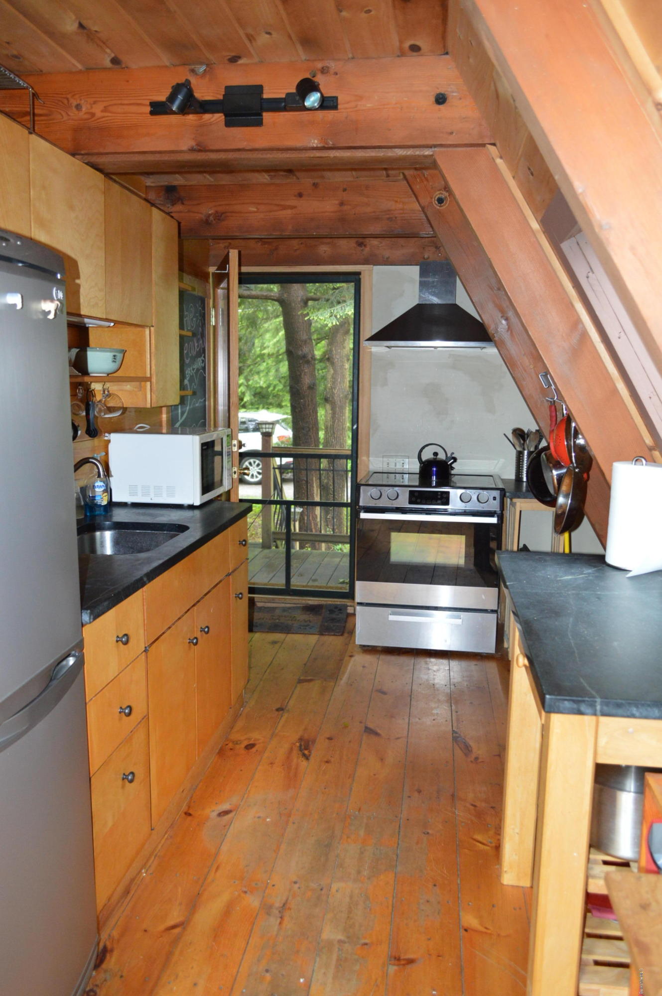 32 Chestnut Road Richmond, MA 01201 - Photo 18 of 31 a kitchen with stainless steel appliances granite countertop a sink and cabinets