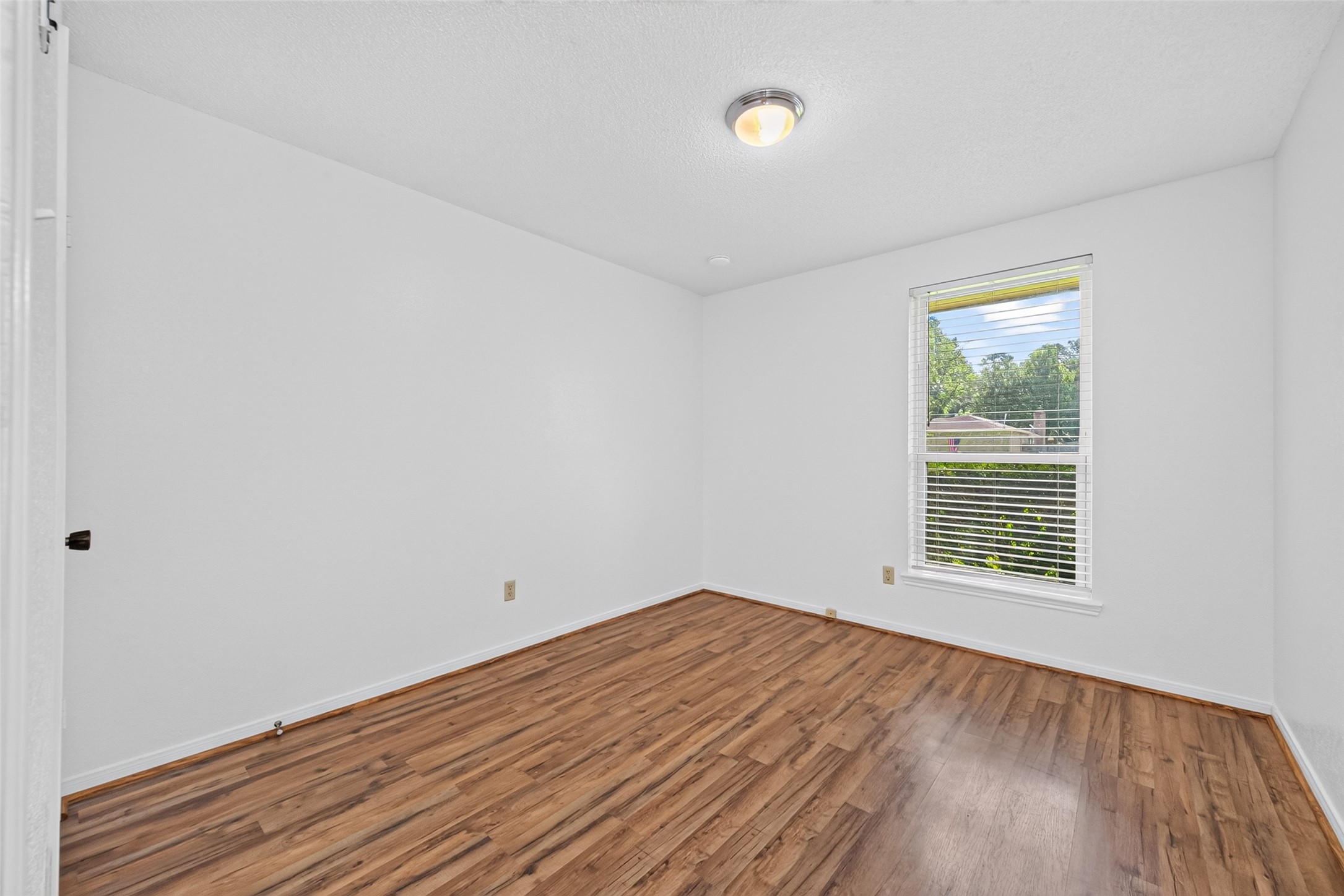 17531 Crestline Road Humble, TX 77396 - Photo 21 of 41 Bright and spacious bedroom featuring elegant hardwood floors and ample natural light.