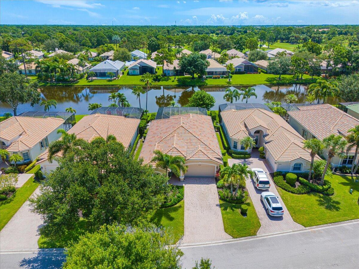8332 Muirfield Way Port St. Lucie, FL 34986 - Photo 12 of 55 an aerial view of residential houses with outdoor space and street view