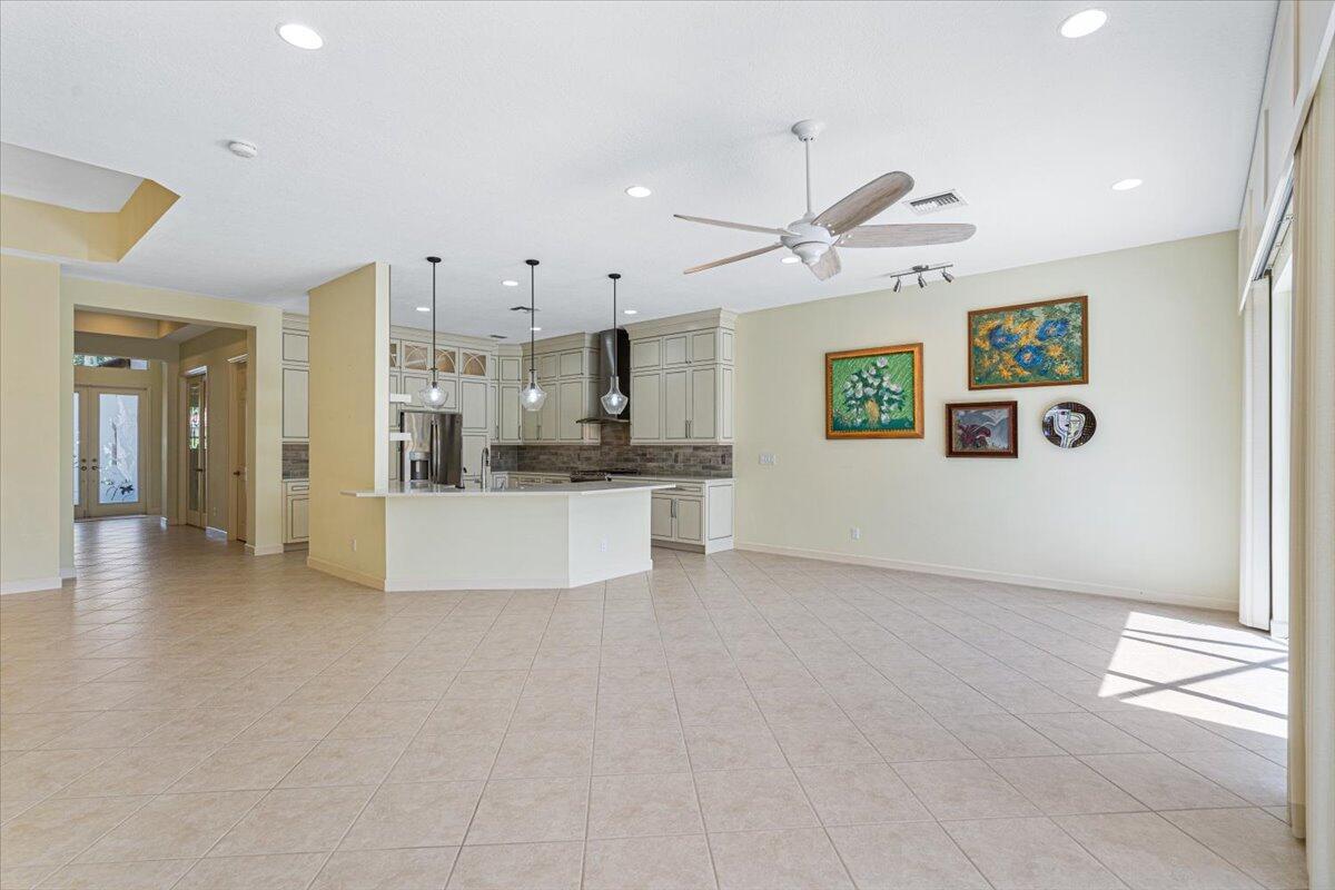 8332 Muirfield Way Port St. Lucie, FL 34986 - Photo 24 of 55 a view of a kitchen with a sink and a refrigerator