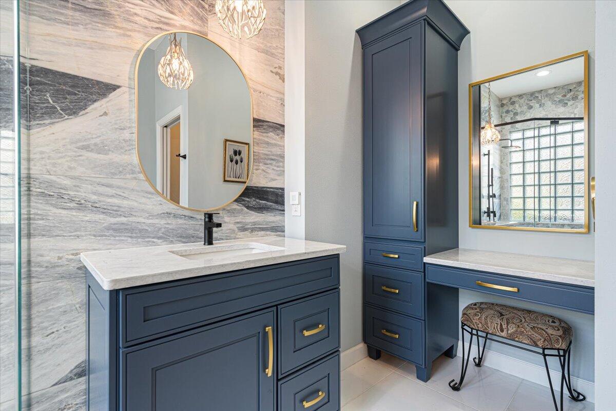 8332 Muirfield Way Port St. Lucie, FL 34986 - Photo 39 of 55 a bathroom with a sink a vanity and a mirror