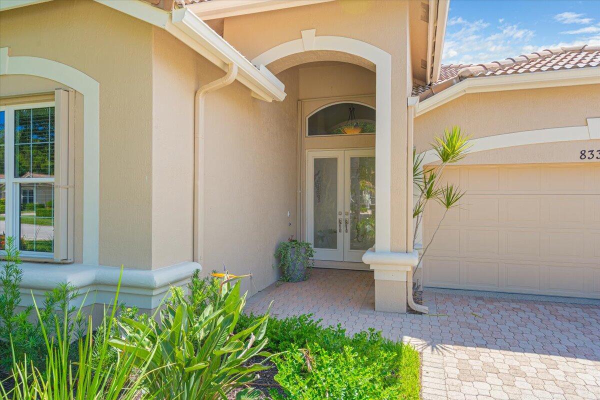 8332 Muirfield Way Port St. Lucie, FL 34986 - Photo 4 of 55 a front view of a house with garden