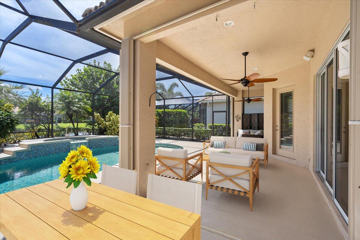 8332 Muirfield Way Port St. Lucie, FL 34986 - Photo 48 of 55 a outdoor space with the couches and dining table with the garden view