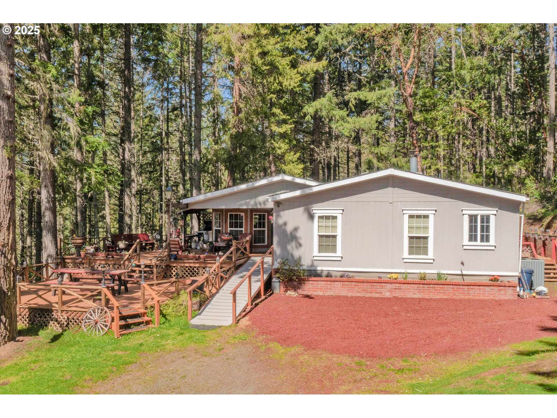 a backyard of a house with table and chairs