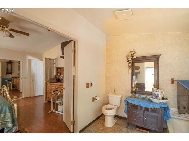 a view of a workspace with furniture and a flat screen tv