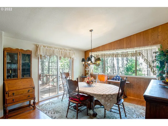 a outdoor dining space with furniture and garden view