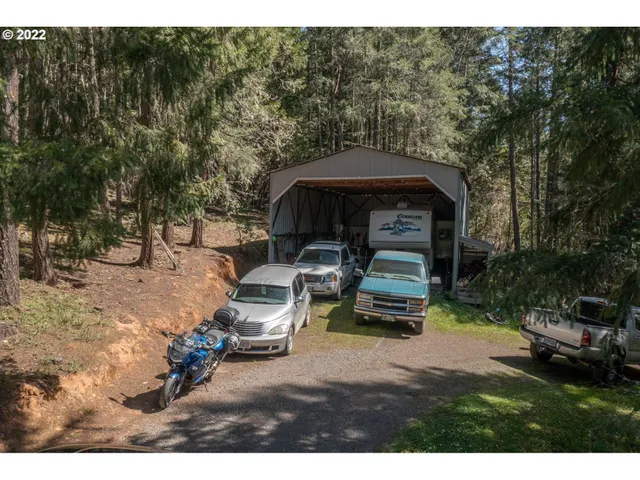 a view of a yard with a house in the background