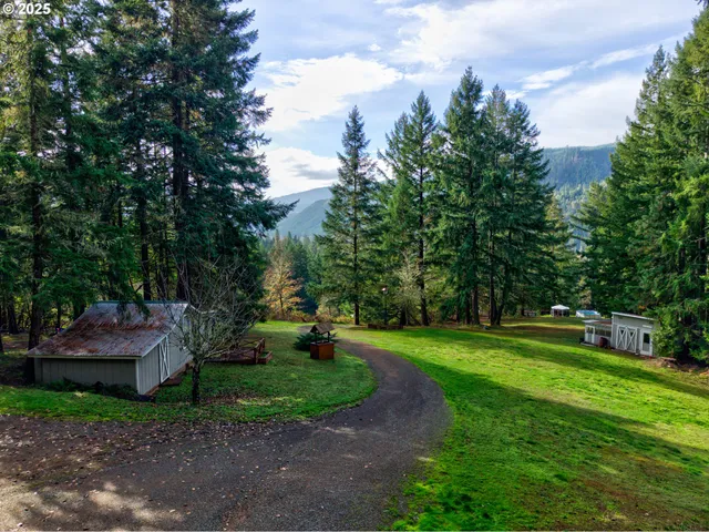 a backyard of a house with table and chairs